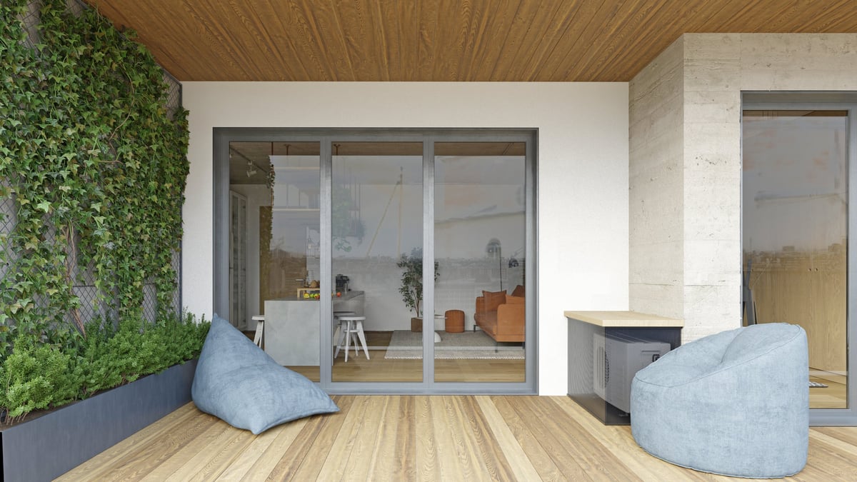 Modern home with large sliding glass doors opening to balcony